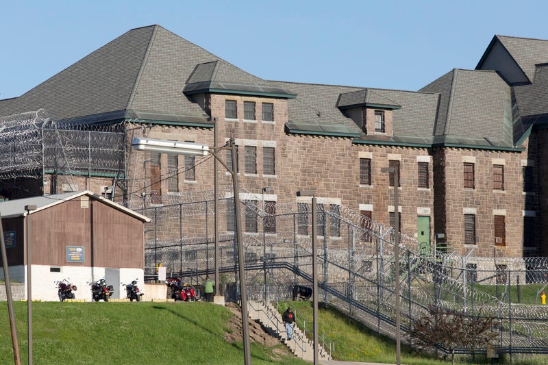 In this June 17, 2015 file photo, an employee leaves the Clinton Correctional Facility in Dannemora, N.Y.