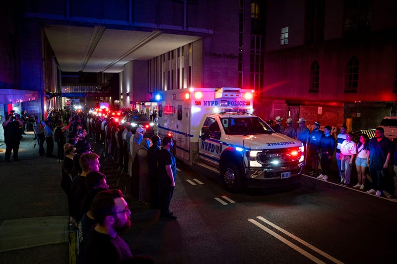 The ambulance carrying the body of Didarul Islam exits NewYork-Presbyterian/Weill Cornell Medical Hospital during the dignified transfer of the slain officer, who was shot and killed by a gunman Monday evening, early Tuesday, July 29, 2025