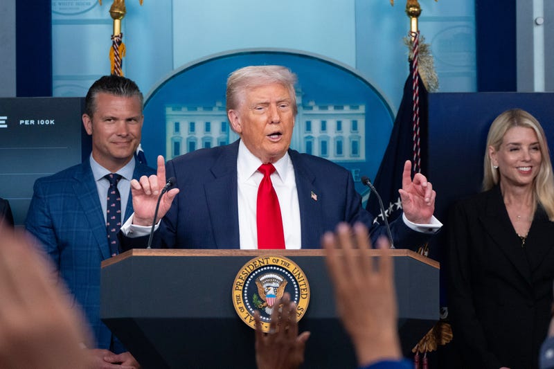 President Donald Trump speaks with reporters in the James Brady Press Briefing Room at the White House, Monday, Aug. 11, 2025, in Washington, as Secretary of Defense Pete Hegseth and Attorney General Pam Bondi look on.