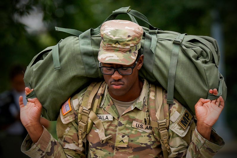 A member of the District of Columbia National Guard arrives at the District of Columbia National Guard Headquarters, Tuesday, Aug. 12, 2025, in Washington.