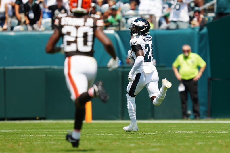 Philadelphia Eagles' Andrew Mukuba (24) looks back at Cleveland Browns running back Pierre Strong Jr. (20) as he runs for a touchdown after an interception during the first half of an NFL preseason football game Saturday, Aug. 16, 2025, in Philadelphia.