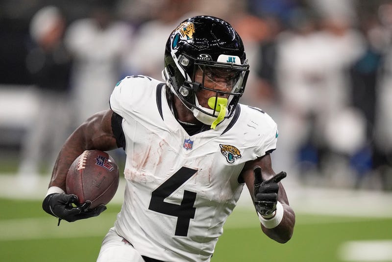Jacksonville Jaguars running back Tank Bigsby (4) runs against the New Orleans Saints in the first half of an NFL preseason football game in New Orleans, Sunday, Aug. 17, 2025.