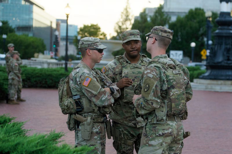 Armed members of the South Carolina National Guard are positioned outside of Union Station in Washington, Sunday, Aug. 24, 2025.