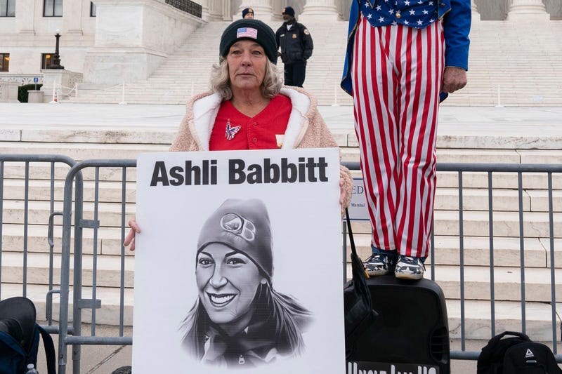 FILE - Micki Witthoeft, center, mother of Ashli Babbitt, the woman fatally shot by police inside the U.S. Capitol during the Jan. 6, 2021, riot, joins protesters outside of the Supreme Court on the second anniversary of the Jan. 6, assault on the U.S. Capitol, in Washington, Jan. 6, 2023.