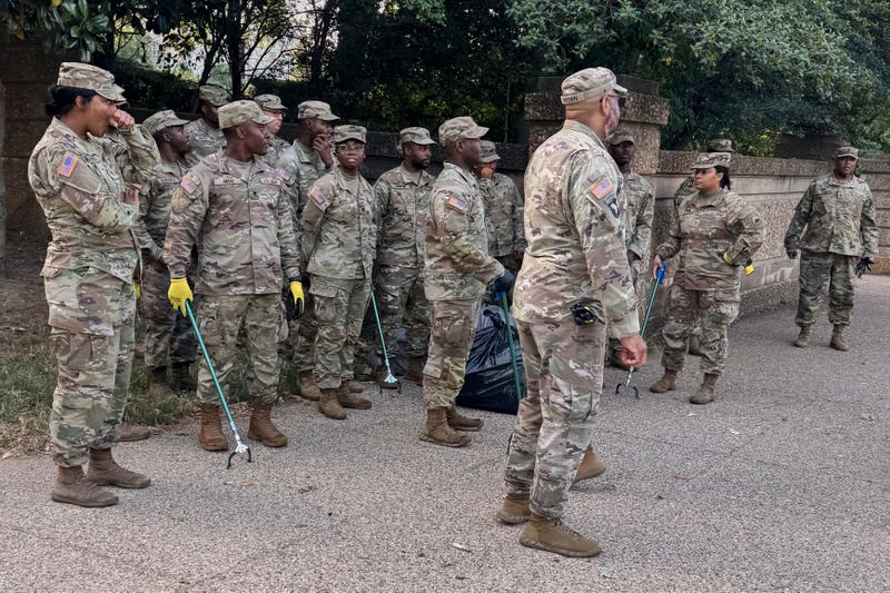 National Guard with tools to pick up trash are seen Tuesday, Sept. 2, 2025 at Meridian Hill Park, in Washington.