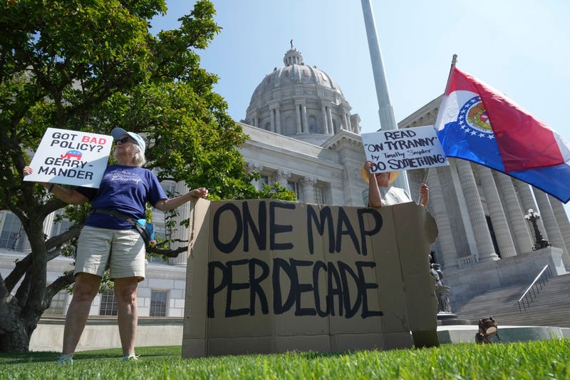 Robin Rothove, left, and Paula Smith, right, demonstrate outside the Missouri Capitol as lawmakers prepare to conduct a committee hearing inside to consider redrawing the state's U.S. House districts, Thursday, Sept. 4, 2025, in Jefferson City, Mo.