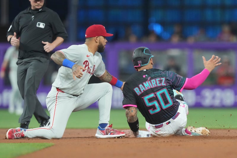 Edmundo Sosa tags Miami Marlins' Agustín Ramírez (50) as he tries to steal the base during the first inning of a baseball game Saturday, Sept. 6, 2025, in Miami.