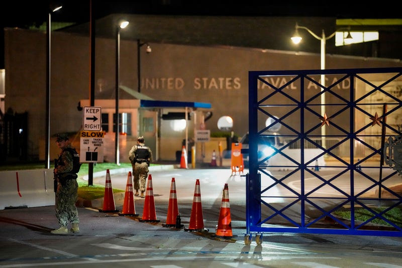 Response vehicles leave through the main gate of the Naval Academy, Thursday, Sept. 11, 2025, in Annapolis, Md. 