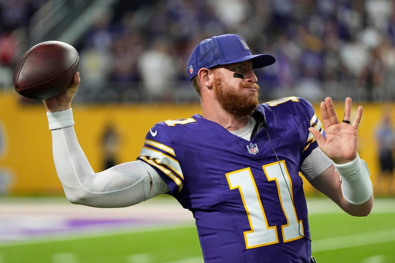 Minnesota Vikings quarterback Carson Wentz (11) warms up during the first half of an NFL football game against the Atlanta Falcons, Sunday, Sept. 14, 2025, in Minneapolis. 