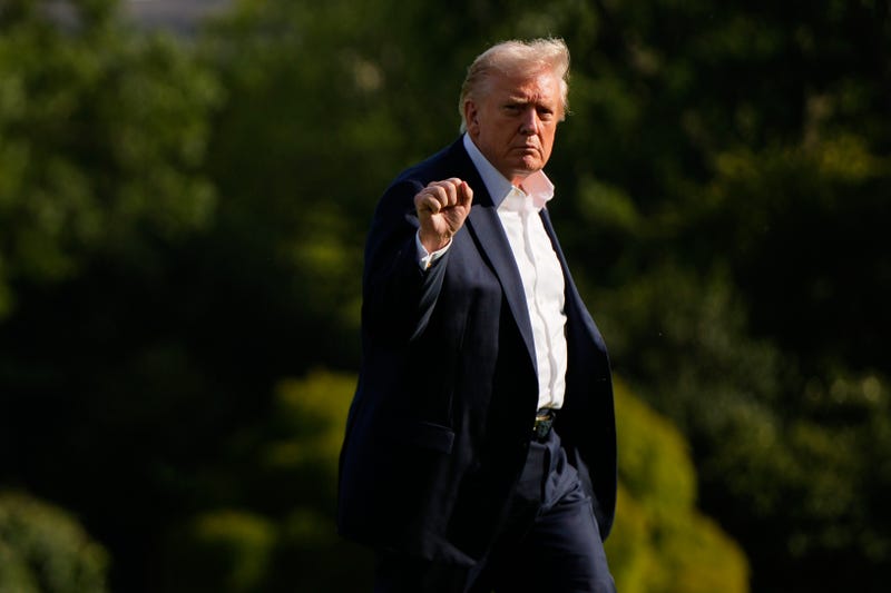 President Donald Trump gestures as he arrives at the White House, Friday, Sept. 26, 2025, in Washington.