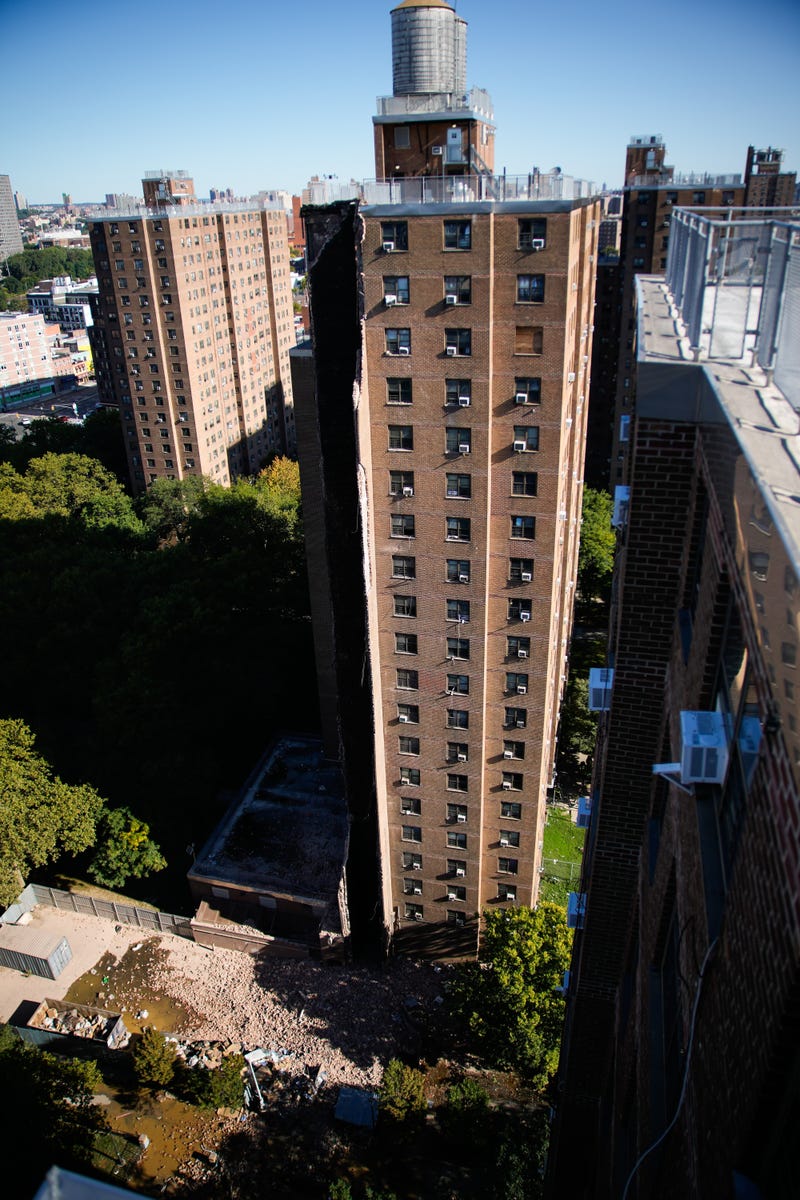 Firefighters work near the site of a building collapse in the Bronx borough of New York, Wednesday, Oct. 1, 2025