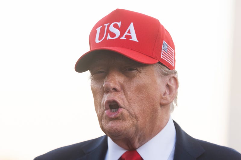 President Donald Trump speaks to reporters upon arrival on the south Lawn at the White House in Washington, Sunday, Oct. 5, 2025.