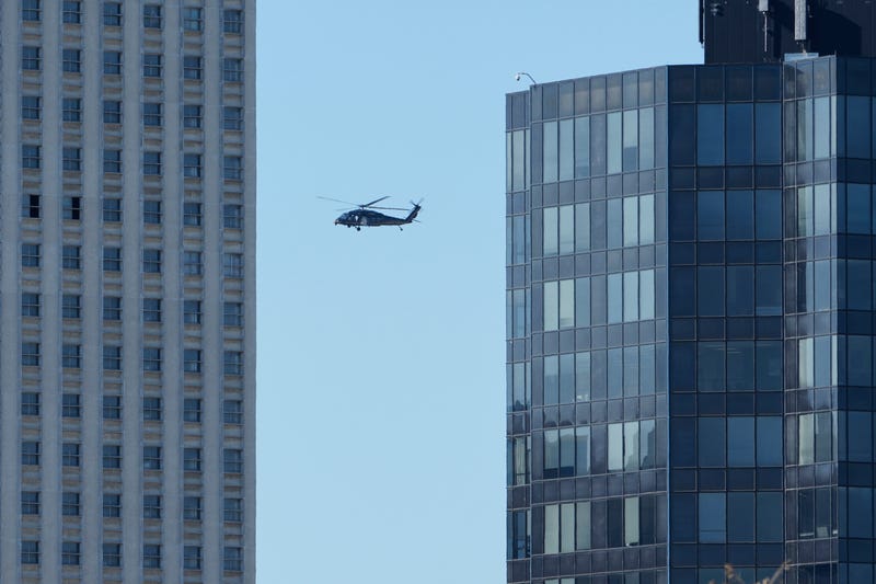 A Blackhawk helicopter flies over the skyline in Memphis, Tenn., Wednesday, Oct. 8, 2025.