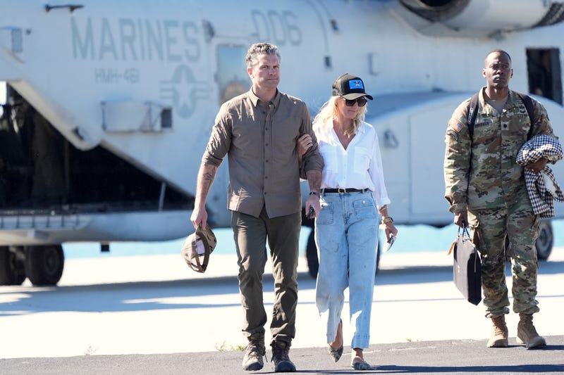 Defense Secretary Pete Hegseth, from left, and his wife Jennifer Rauchet walk during activities to mark the upcoming Marine Corps' 250th anniversary Saturday, Oct 18, 2025, on Marine Corps Base Camp Pendleton in Camp Pendleton, Calif.