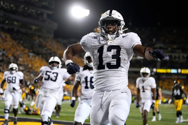 Penn State running back Kaytron Allen (13) celebrates after a touchdown run in the second half of an NCAA college football game against Iowa, Saturday, Oct. 18, 2025, in Iowa City, Iowa. 