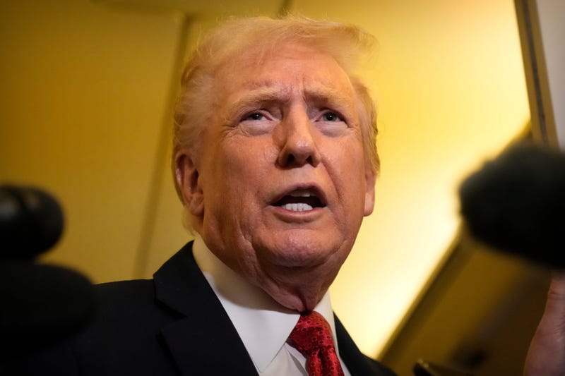 President Donald Trump speaks to reporters aboard Air Force One, Sunday, Oct. 19, 2025, en route to Joint Base Andrews, Md., as he returns from a trip to Florida.