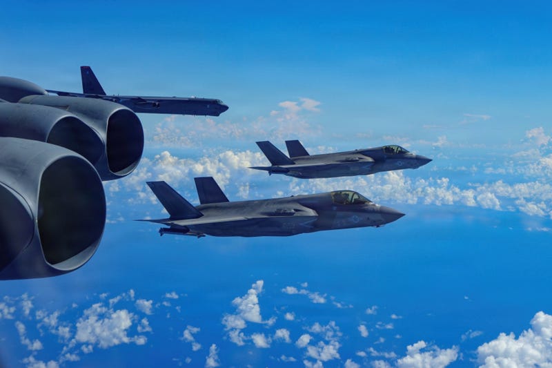 In this image provided by the U.S. Air Force, a Air Force B-52H Stratofortress bomber flies with Marine Corps F-35B Lightning II aircraft in the U.S. Southern Command area of responsibility, Oct. 15, 2025.