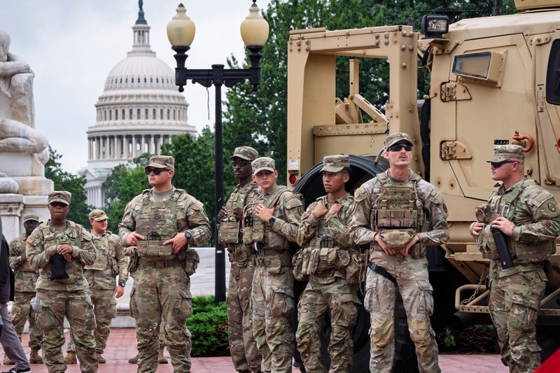 FILE - National Guard troops congregate at the entrance to Union Station in Washington, Aug. 20, 2025.