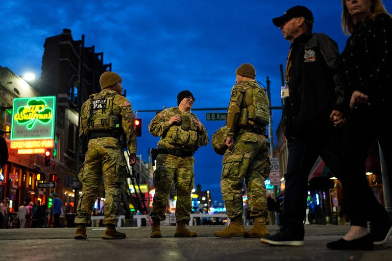 Members of the National Guard stand watch at the intersection of B.B. King Blvd. and Beale Street, Friday, Oct. 24, 2025, in Memphis, Tenn.