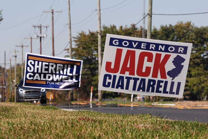 Campaign signs supporting New Jersey gubernatorial candidates Democratic Mikie Sherrill and Republican Jack Ciattarelli are posted along a roadside in Mount Laurel, N.J., Monday, Oct. 27, 2025.