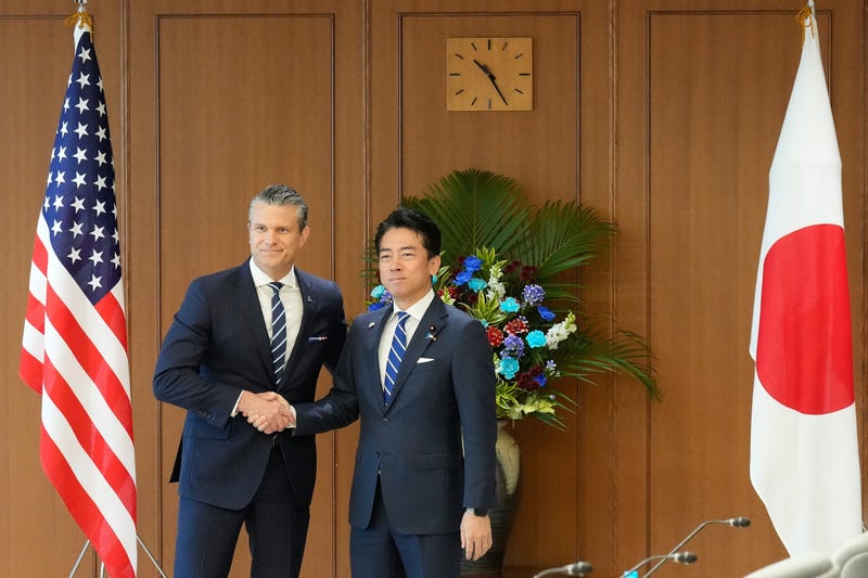Japan's Defense Minister Shinjiro Koizumi, right, and U.S. Defense Secretary Pete Hegseth shake hands before their meeting at the Japanese defense ministry in Tokyo Wednesday, Oct. 29, 2025. (
