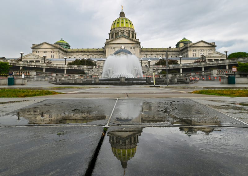 FILE - The Pennsylvania State Capitol is reflected on the ground June 30, 2025, in Harrisburg, Pa. 