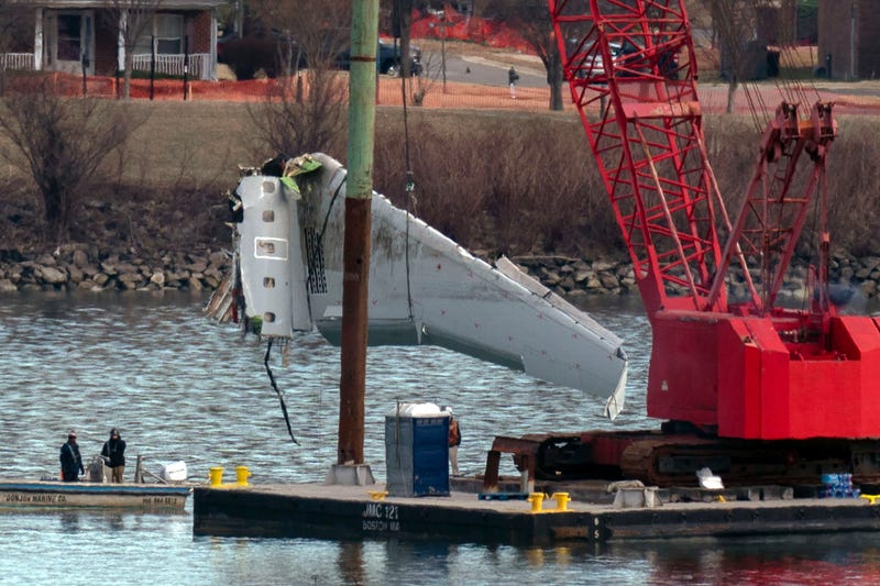 FILE - Rescue and salvage crews pull up airplane wreckage of an American Airlines jet in the Potomac River from Ronald Reagan Washington National Airport, Feb. 3, 2025, in Arlington, Va.