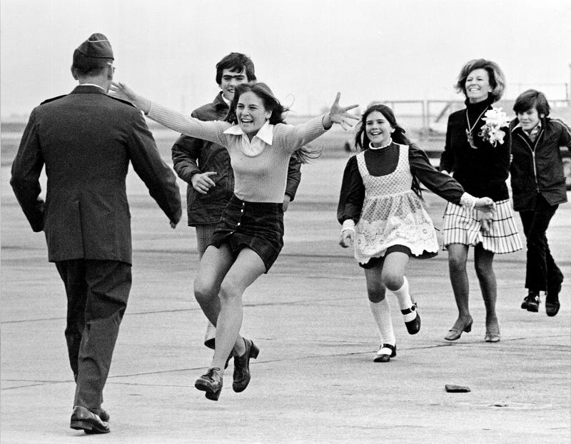 FILE - Released prisoner of war Lt. Col. Robert L. Stirm is greeted by his family at Travis Air Force Base in Fairfield, Calif., as he returns home from the Vietnam War, March 17, 1973.