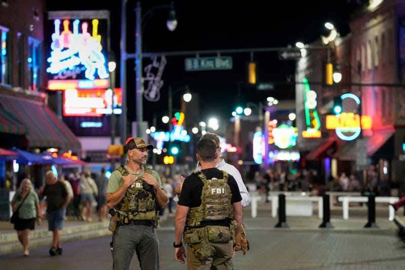 FILE - Federal law enforcement agents walk on Beale Street, Oct. 10, 2025, in Memphis, Tenn.