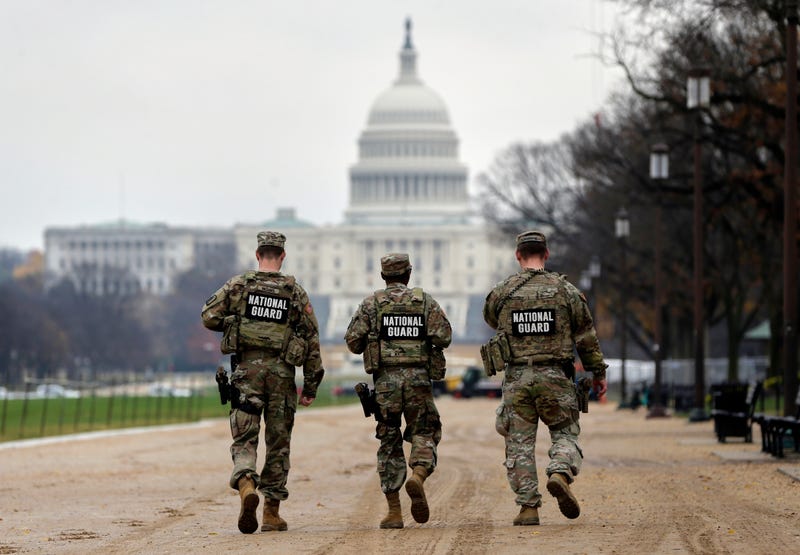 National Guard patrol along the National Mall in front of the Capitol, Wednesday, Nov. 26, 2025, in Washington.