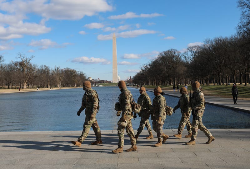 National Guard patrol in the Lincoln Memorial, Thursday, Dec. 11, 2025, in Washington. The Washington Monument is seen in the background.