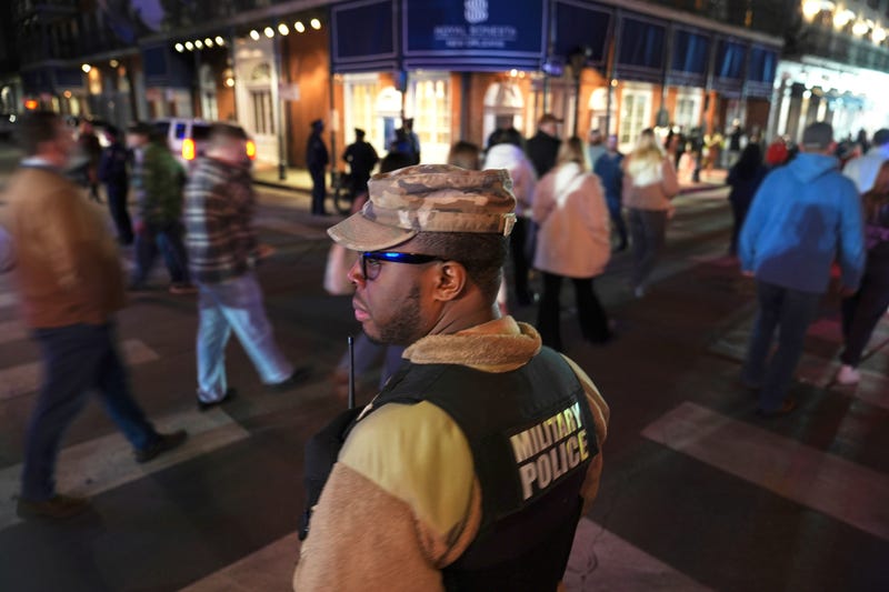 FILE - Spc. Nelson Harrison, of the Louisiana National Guard, stands guard on Bourbon Street in the French Quarter, Jan. 2, 2025, in New Orleans.