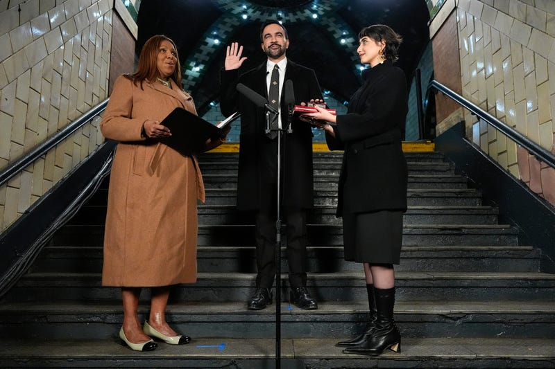 New York Attorney General Letitia James, left, administers the oath of office to mayor-elect Zohran Mamdani, center, as his wife Rama Duwaji looks on, Thursday, Jan. 1, 2026, in New York