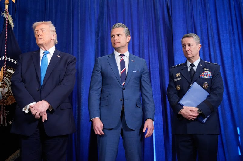 President Donald Trump, Defense Secretary Pete Hegseth and Chairman of the Joint Chiefs of Staff Gen. Dan Caine listen as Secretary of State Marco Rubio speaks during a news conference at Mar-a-Lago, Saturday, Jan. 3, 2026, in Palm Beach, Fla.