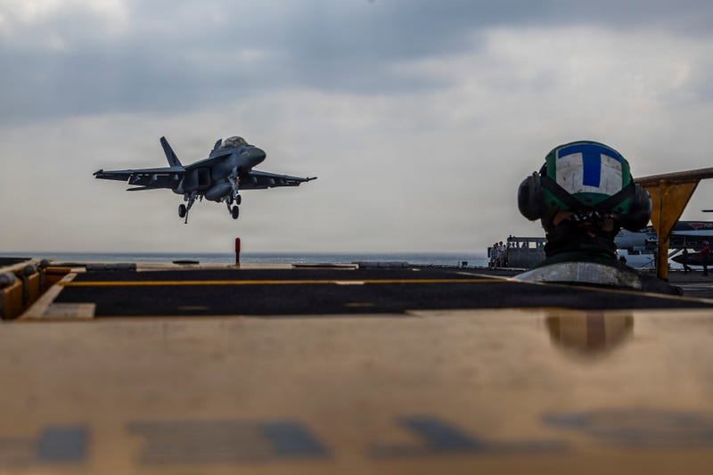 This photo provided by the U.S. Navy shows a Boeing F/A-18E Super Hornet landing on the Nimitz-class aircraft carrier USS Abraham Lincoln in the Indian Ocean on Jan. 22, 2026.