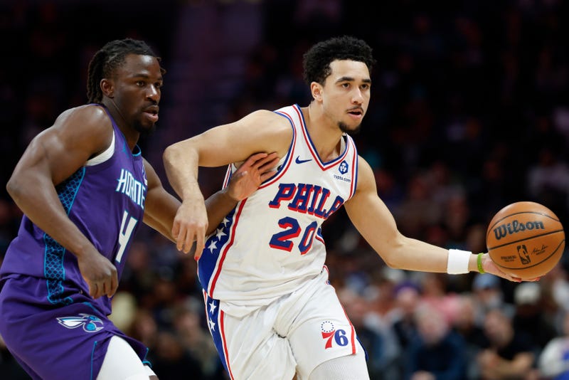 Philadelphia 76ers guard Jared McCain (20) moves the ball as Charlotte Hornets guard Sion James defends during the second half of an NBA basketball game in Charlotte, N.C., Monday, Jan. 26, 2026.