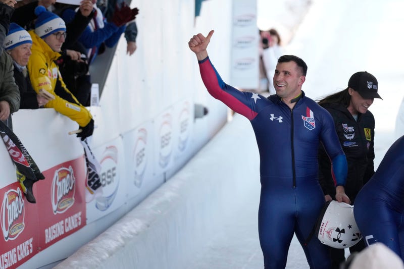 FILE -Frank del Duca, pilot of the fourth-place United States team, waves to fans after the 4-man bobsled event at the bobsled world championships, March 15, 2025, in Lake Placid, N.Y.