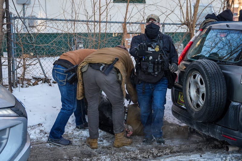 An activist is detained by federal agents on Tuesday, Feb. 3, 2026, in Minneapolis. 
