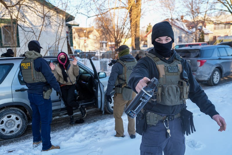 Activists are approached by federal agents for following agent vehicles, on Tuesday, Feb. 3, 2026, in Minneapolis.