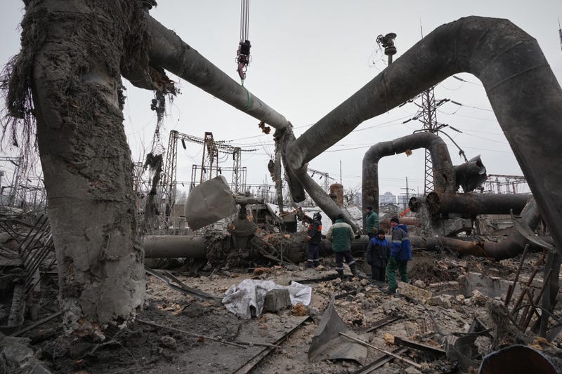 Workers clean up damage at Darnytsia Thermal Power Plant after a Russian attack in Kyiv, Ukraine, Wednesday, Feb. 4, 2026.