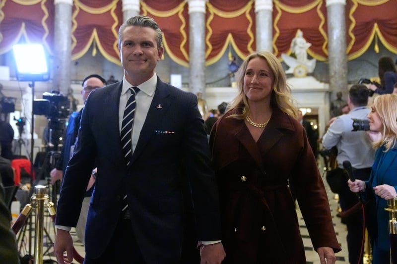 Defense Secretary Pete Hegseth and his wife Jennifer Rauchet arrive before President Donald Trump delivers the State of the Union address to a joint session of Congress in the House chamber at the U.S. Capitol in Washington, Tuesday, Feb. 24, 2026.