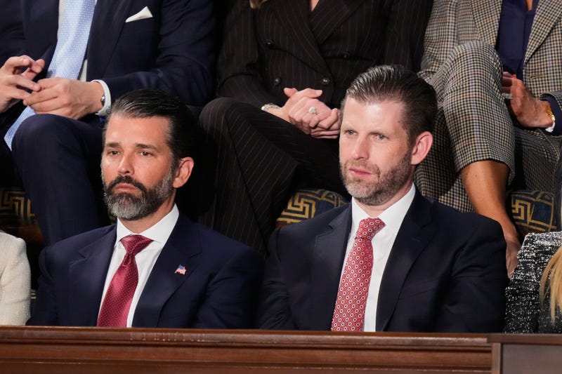 Donald Trump Jr. and Eric Trump listen to President Donald Trump's State of the Union address to a joint session of Congress in the House chamber at the U.S. Capitol in Washington, Tuesday, Feb. 24, 2026.