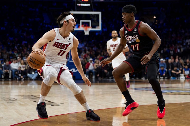 Miami Heat's Jaime Jaquez Jr., left, looks to make his move against Philadelphia 76ers' VJ Edgecombe, right, during the first half of an NBA basketball game, Thursday, Feb. 26, 2026, in Philadelphia. 