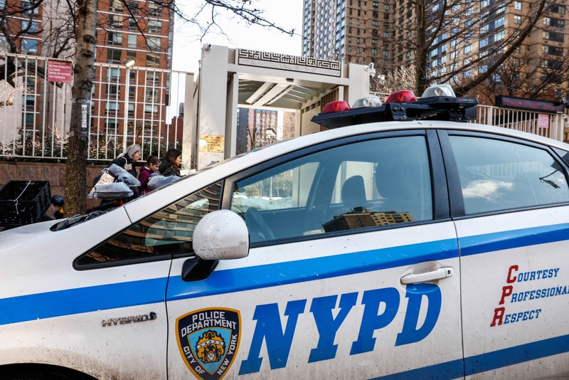 NYPD cars are seen outside the Islamic Cultural Center of New York, Saturday, Feb. 28, 2026, in New York. 