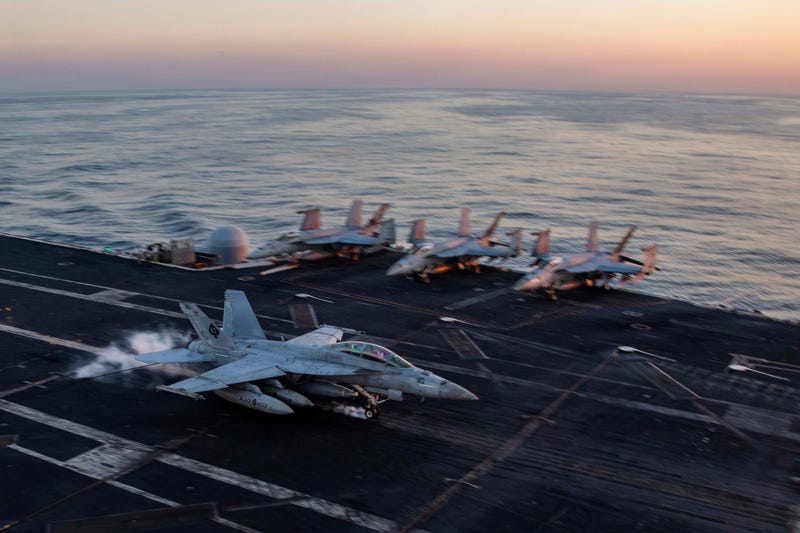 This image provided by U.S. Central Command shows a F/A-18F Super Hornet preparing to make an arrested landing on the USS Abraham Lincoln (CVN 72)) in support of Operation Epic Fury, on Saturday, Feb. 28, 2026.
