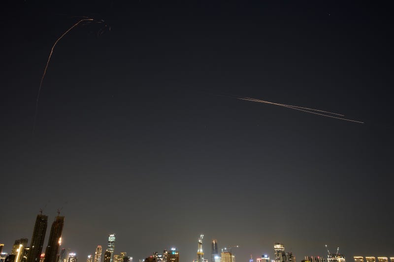 Israeli air defense system fires to intercept missiles during an Iranian attack over Tel Aviv, Israel, early Tuesday, March 3, 2026.
