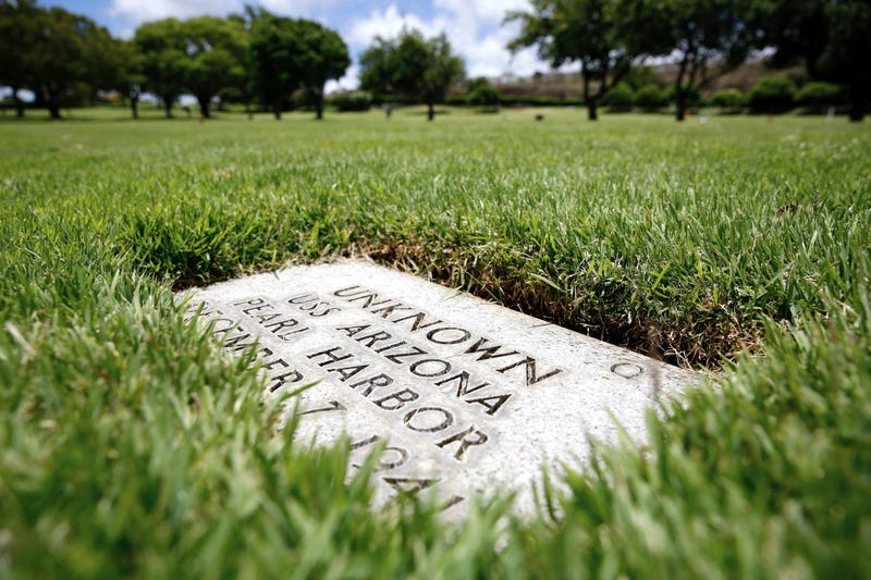 FILE - A grave marker for an unknown casualty from the USS Arizona is shown at the National Memorial Cemetery of the Pacific, July 15, 2021, in Honolulu.