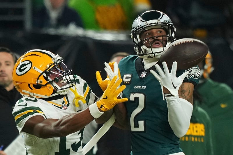 Philadelphia Eagles cornerback Darius Slay (2) intercepts a pass intended for Green Bay Packers wide receiver Dontayvion Wicks (13).