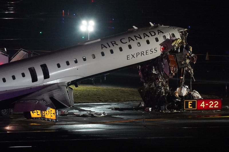 An Air Canada Jet sits on the runway at LaGuardia Airport, Monday, March 23, 2026, after colliding with a Port Authority aircraft rescue and firefighting vehicle after landing in New York