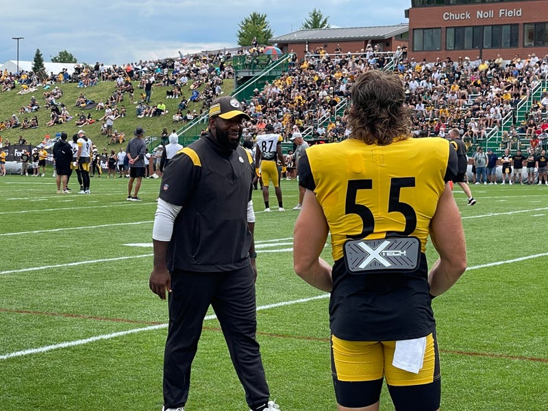 Cole Holcomb with coach Aaron Curry